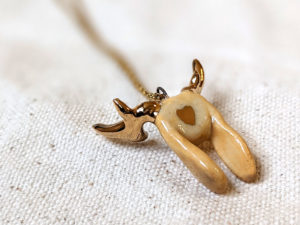 lop bunny pendant with golden antlers