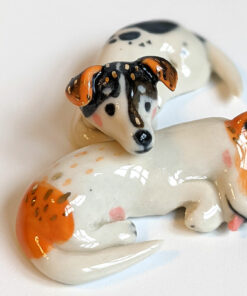 jack russel cuddling figurines