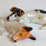 jack russel cuddling figurines