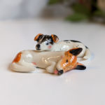 jack russel cuddling figurines