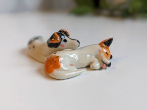 jack russel cuddling figurines