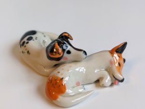 jack russel cuddling figurines