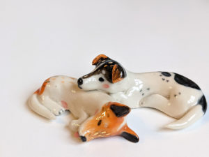 jack russel cuddling figurines