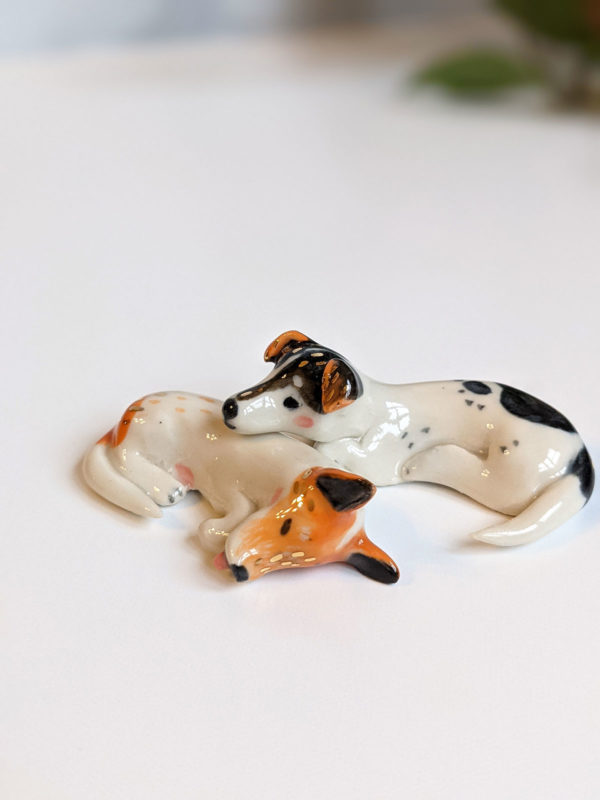 jack russel cuddling figurines