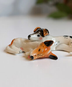 jack russel cuddling figurines