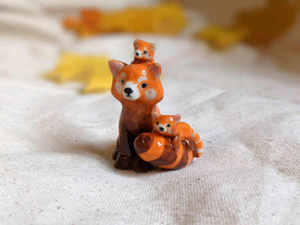 red panda family porcelain figurine