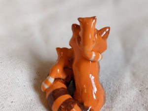 red panda family porcelain figurine