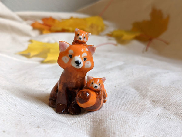red panda family porcelain figurine