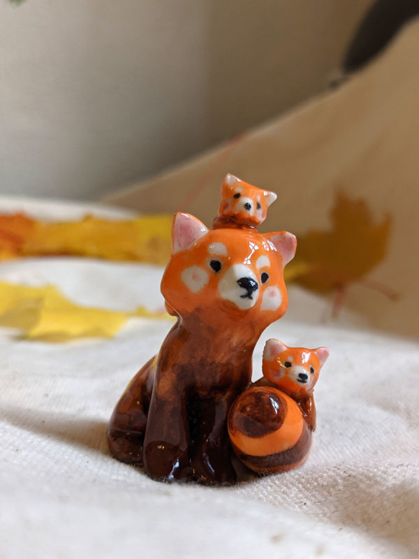 red panda family porcelain figurine