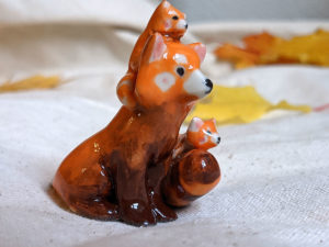 red panda family porcelain figurine