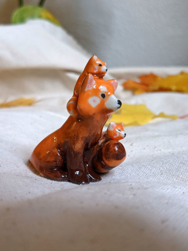 red panda family porcelain figurine