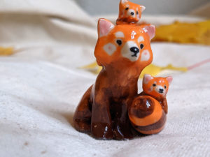 red panda family porcelain figurine