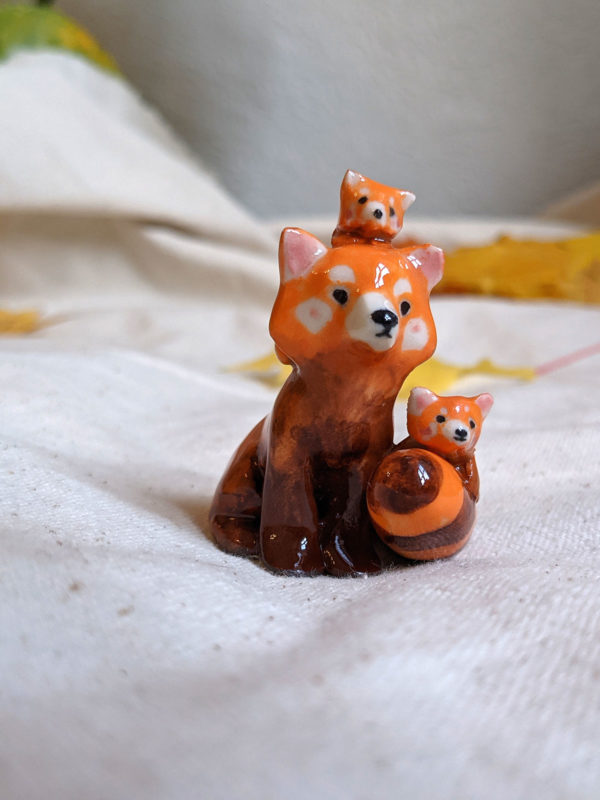 red panda family porcelain figurine