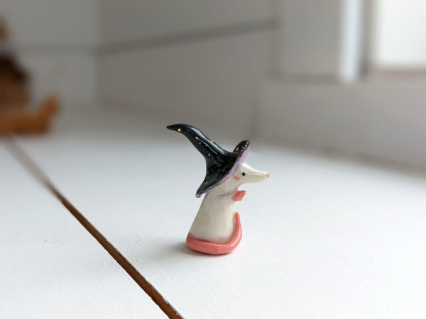 porcelain witch rat figurine