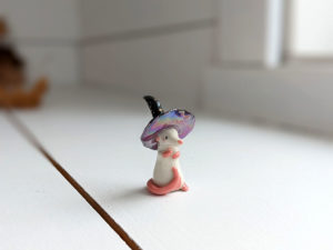 porcelain witch rat figurine