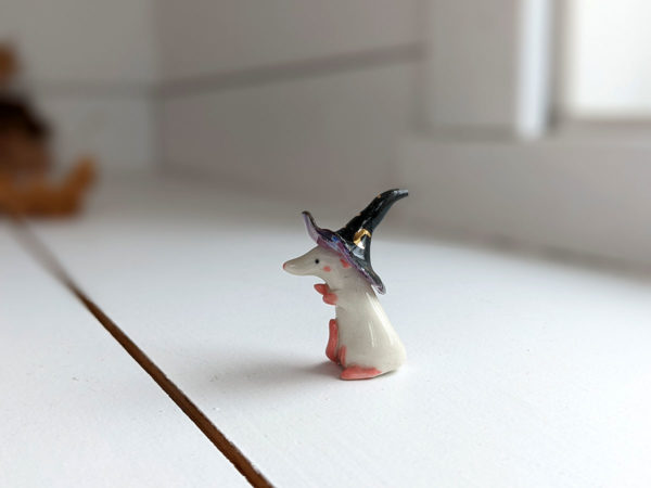 porcelain witch rat figurine
