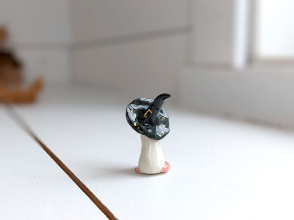 porcelain witch rat figurine