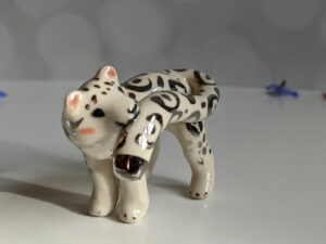 porcelain figurine snow leopard tail white gold