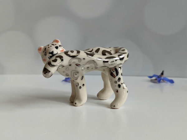 porcelain figurine snow leopard tail white gold