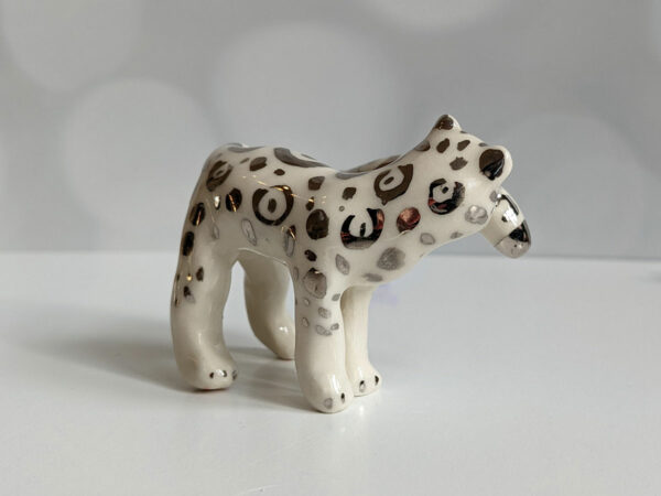 porcelain figurine snow leopard tail white gold