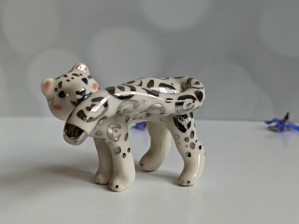 porcelain figurine snow leopard tail white gold