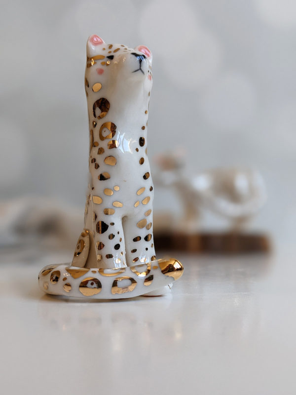 porcelain figurine snow leopard gold