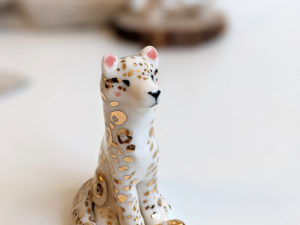 porcelain figurine snow leopard gold