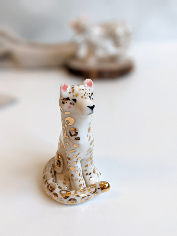 porcelain figurine snow leopard gold