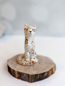 porcelain figurine snow leopard gold