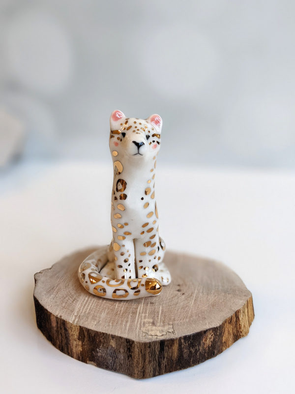 porcelain figurine snow leopard gold