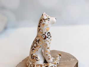 porcelain figurine snow leopard gold