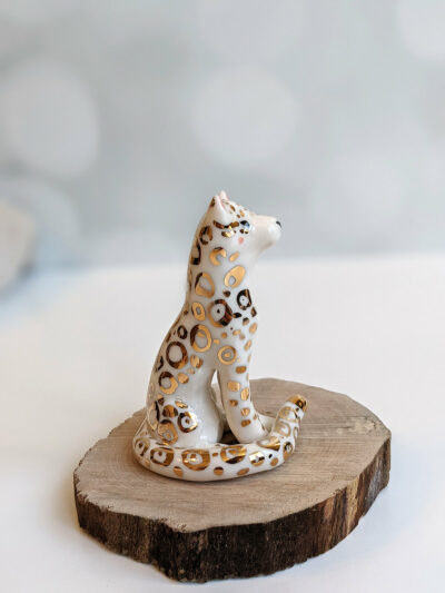 porcelain figurine snow leopard gold
