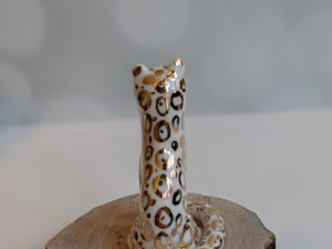 porcelain figurine snow leopard gold