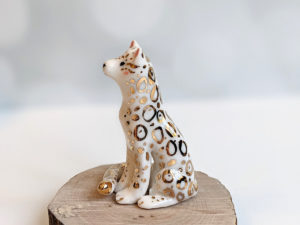 porcelain figurine snow leopard gold