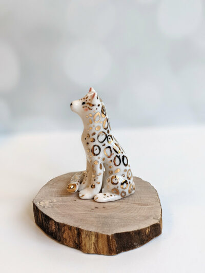 porcelain figurine snow leopard gold