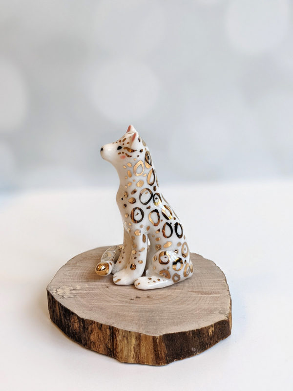 porcelain figurine snow leopard gold