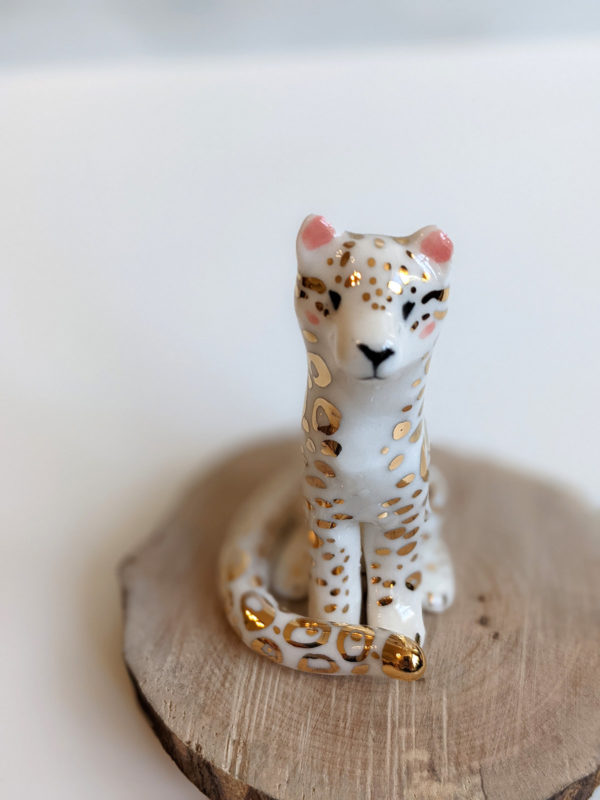 porcelain figurine snow leopard gold