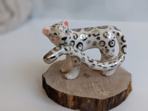 porcelain figurine snow leopard tail white gold