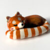 porcelain red panda figurine