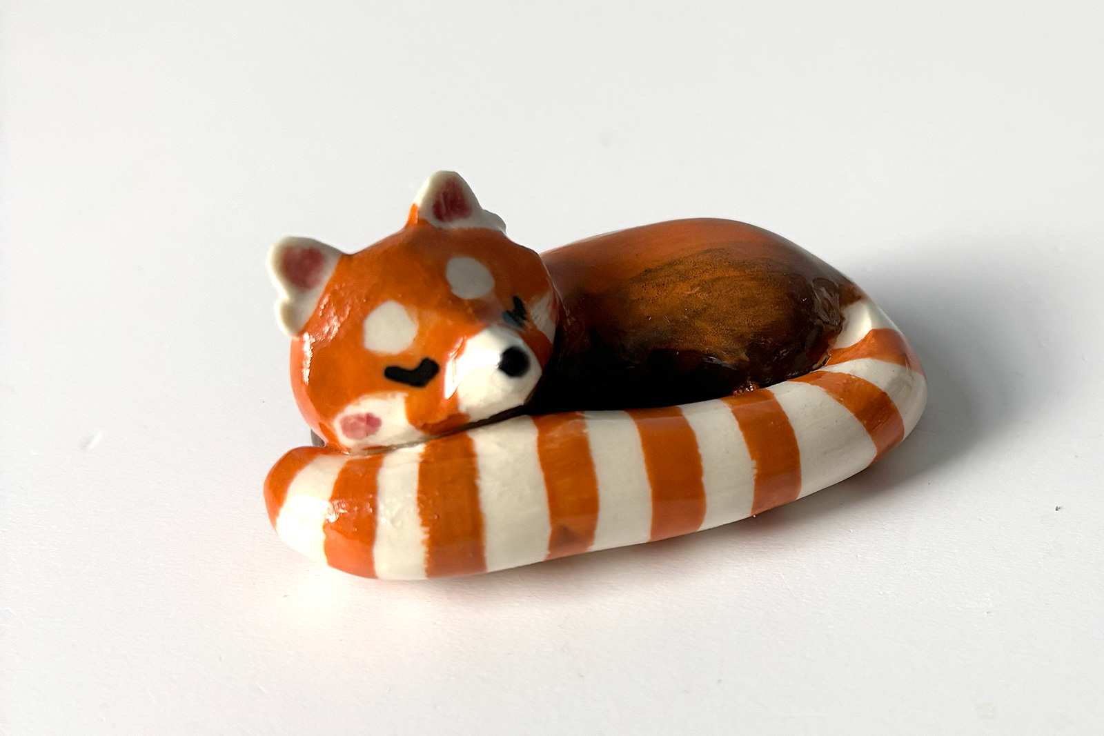porcelain red panda figurine