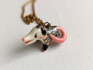 screaming opossum pendant