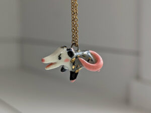 screaming opossum pendant