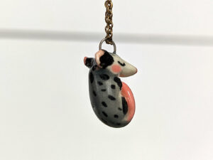 adorable sleeping opossum pendant in porcelain
