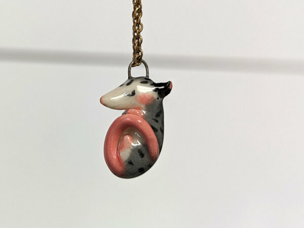 adorable sleeping opossum pendant in porcelain