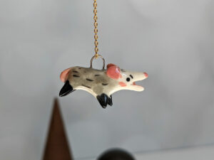 screaming opossum pendant