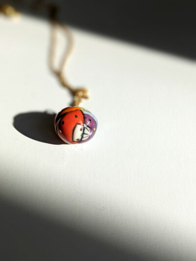 pride rainbow isopod pendant porcelain