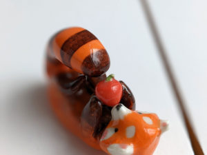 red panda and apple figurine