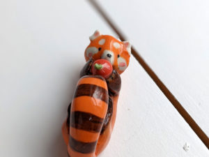 red panda and apple figurine