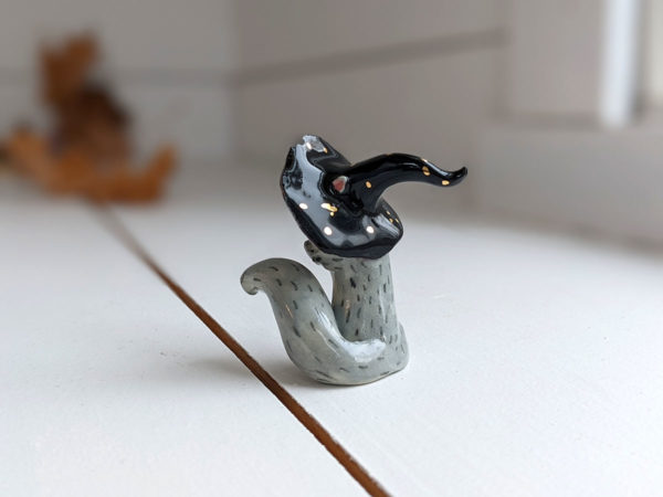 porcelain witch squirrel figurine