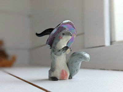 porcelain witch squirrel figurine